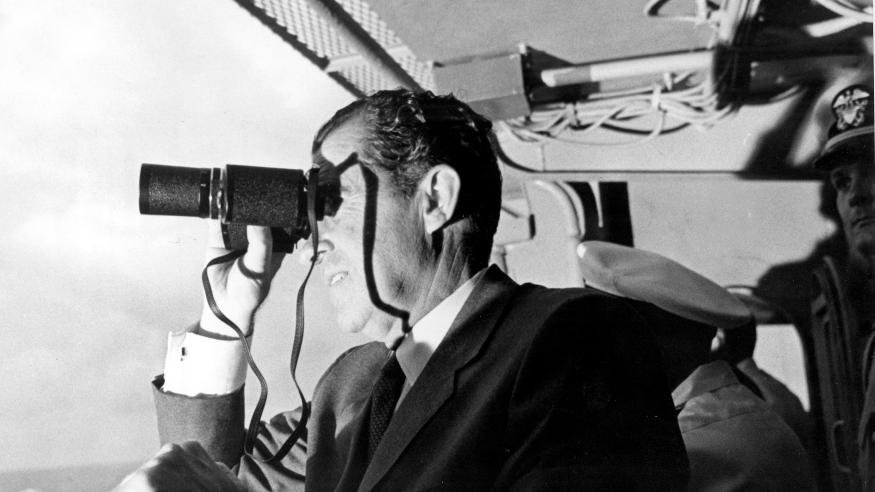 U.S. President Nixon looking through binoculars. Photo courtesy of NASA.